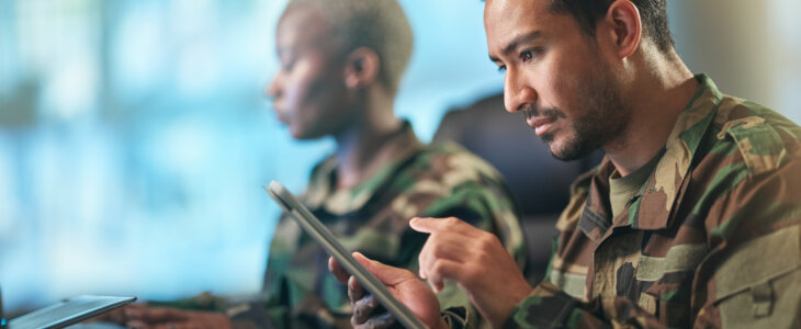 Asian man, army and tablet in research for military equipment, browsing or checking data at base. Male person, security or soldier working on technology for online search or networking at workplace